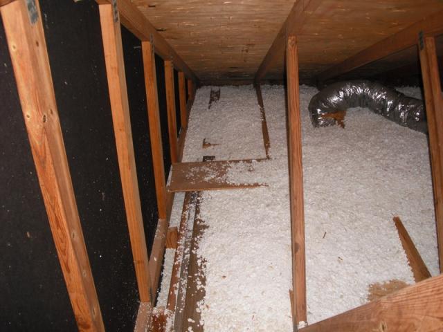 Unconventional insulation. Chopped styrofoam (packing peanuts) used as attic insulation