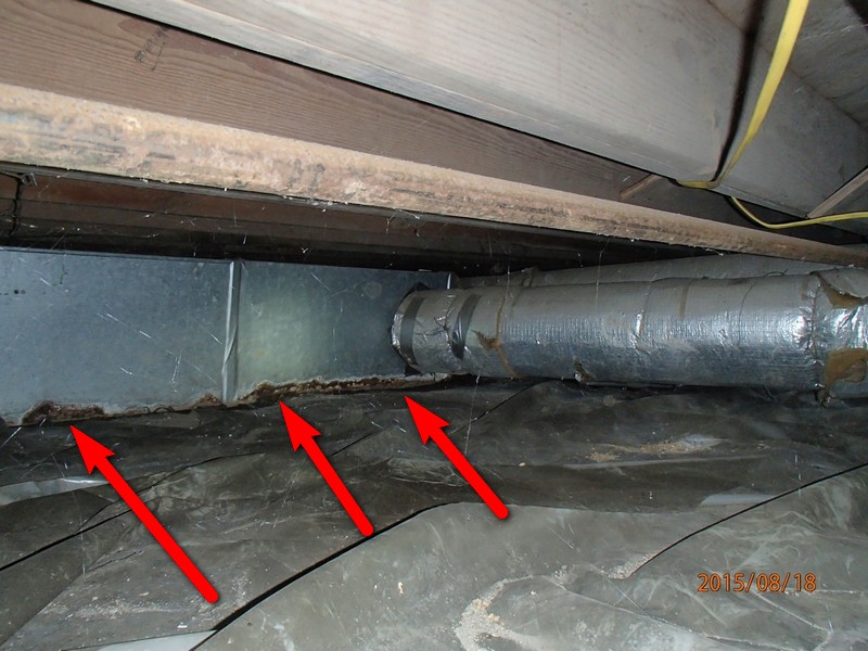 Rusted out ductwork leaking conditioned air into crawlspace.